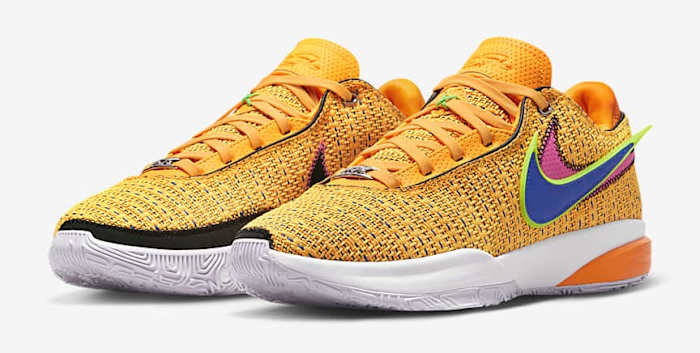 Side view of LeBron James' orange and blue Nike shoes.